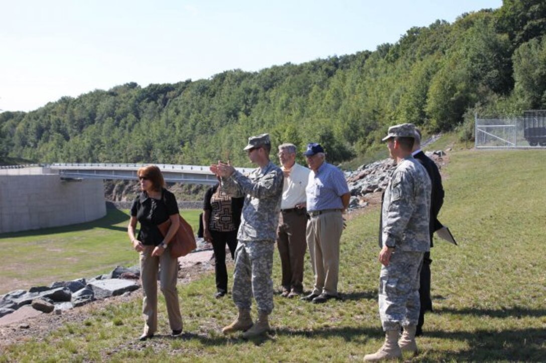 Lt. Col Chris Becking, commander of the U.S. Army Corps of Engineers Philadelphia District, speaks with Ms. Jo-Ellen Darcy, the Assistant Secretary of the Army for Civil Works, during a tour of Prompton Dam in Wayne County.