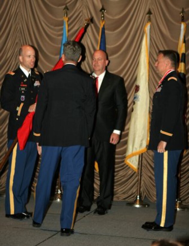 Philadelphia District Commander Lt. Col. Chris Becking accepts the colors from North Atlantic Division Commander Col. Christopher J. Larsen during a June 26th Change of Command ceremony. Outgoing commander Lt. Col. Phillip Secrist and Deputy for Program Management Curt Heckelman watch the exchange of the colors.