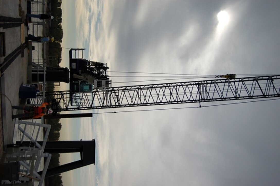 The U.S. Army Corps of Engineers' Marine Design Center's mooring rehabilitation contractor installs a Mantis Crane at the St. Louis District Service Base Moorings.