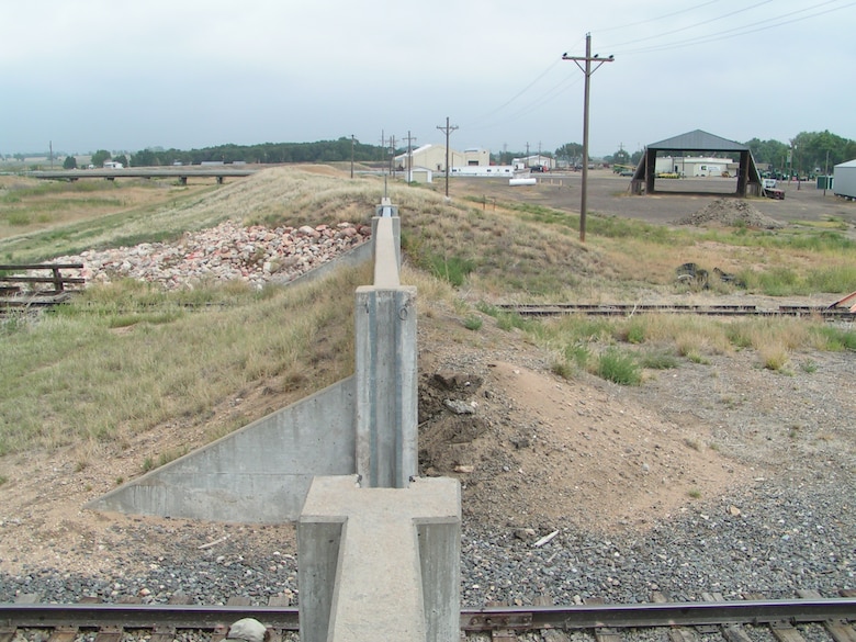 The Holly Wildhorse Creek and Arkansas River levee in Holly, Colo., east of Lamar, Colo., is one of many levees in the District’s area of operations.  Its features include a railroad closure section with stop logs in place, levee with protected area to the right, and a highway bridge. 
