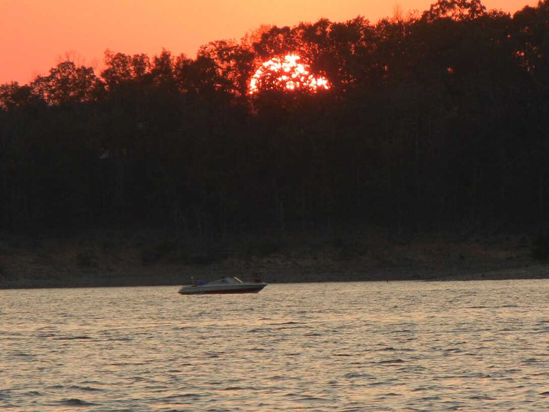 Boating at sunset on Broken Bow Lake
