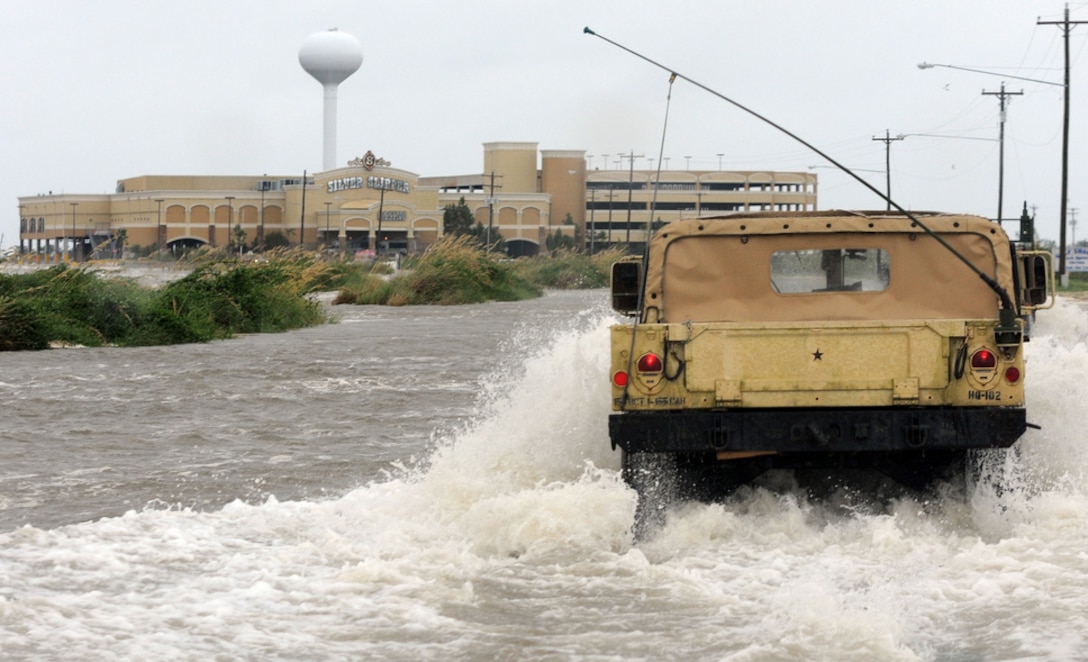 Soldiers in a Humvee travel through a storm surge to assist Hancock County sheriff deputies make contact with civilians stranded near the Gulf Coast in Waveland, Miss., Aug. 28, 2012. The soldiers are assigned to the Mississippi Army National Guard.