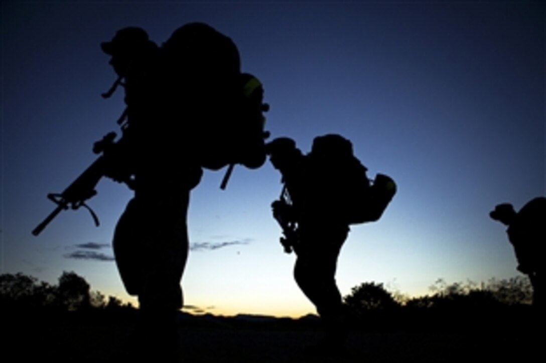 Marines conduct an early morning five kilometer hike to the grenade range as part of Marine Combat training on Marine Corps Base Camp Pendleton, Ca., Aug. 28, 2012. The Marines are constantly being pushed to and beyond their limits so they are ready physically and mentally for combat.