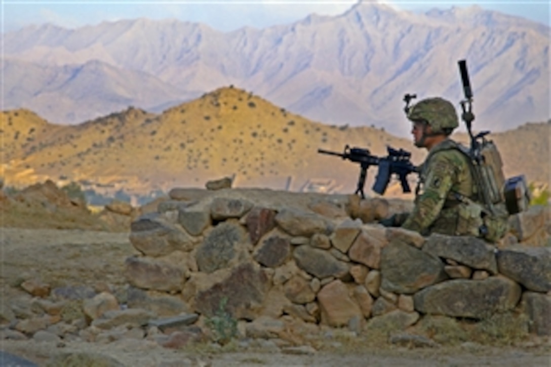U.S. Army Pfc. Sean Serritelli provides security during a combat operation outside Combat Outpost Charkh in Afghanistan's Logar province, Aug. 23, 2012. Serritelli is assigned to Company L, 1st Battalion, 503rd Infantry Regiment. 