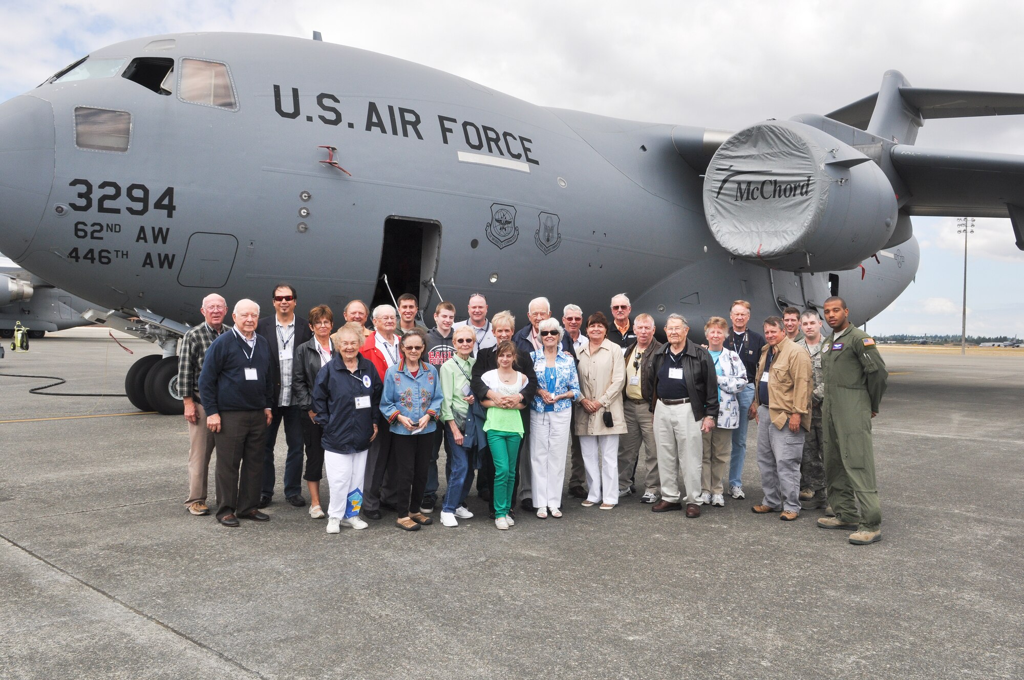 Members of the Distinguished Flying Cross Society and their guests stand with aircrew members Aug. 22, 2012, in front of a C-17 Globemaster III aircraft at Joint Base Lewis-McChord, Wash. The group met with Airman and got an up-close look at a C-17 aircraft. (U.S. Air Force photo/Staff Sgt. Sean Tobin)