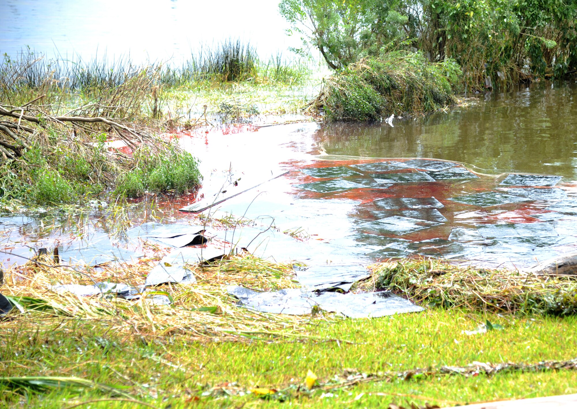 Fuel is visible in the Biloxi Back Bay, Miss., Aug. 30, 2012. Keesler and local environmental officials responded to a nearly 3,000-gallon diesel fuel spill from a generator that leaked from the base commissary into Biloxi’s Back Bay.  (U.S. Air Force photo by Kemberly Groue)