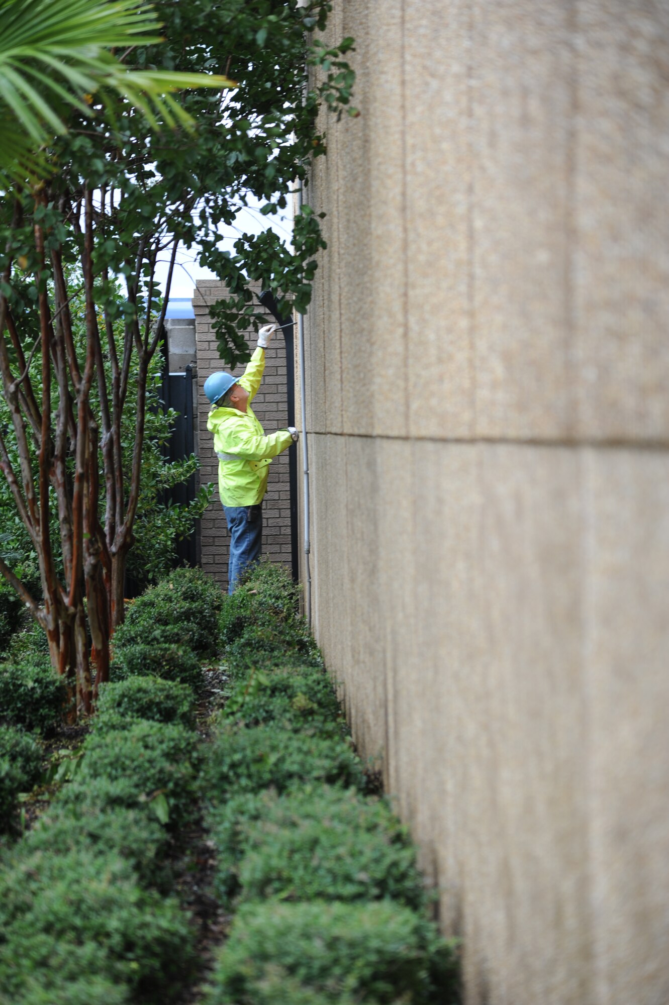 John Akins, CSC, removes boards from the windows of Base Operations center Aug. 30, 2012, at Keesler Air Force Base, Miss., during base restoration following landfall of Hurricane Isaac. In an effort to ensure the safety of Keesler personnel and assets during Hurricane Isaac, the base was closed Aug. 28-29 and reopened Aug. 30 following minimal damage.  (U.S. Air Force photo by Kemberly Groue)