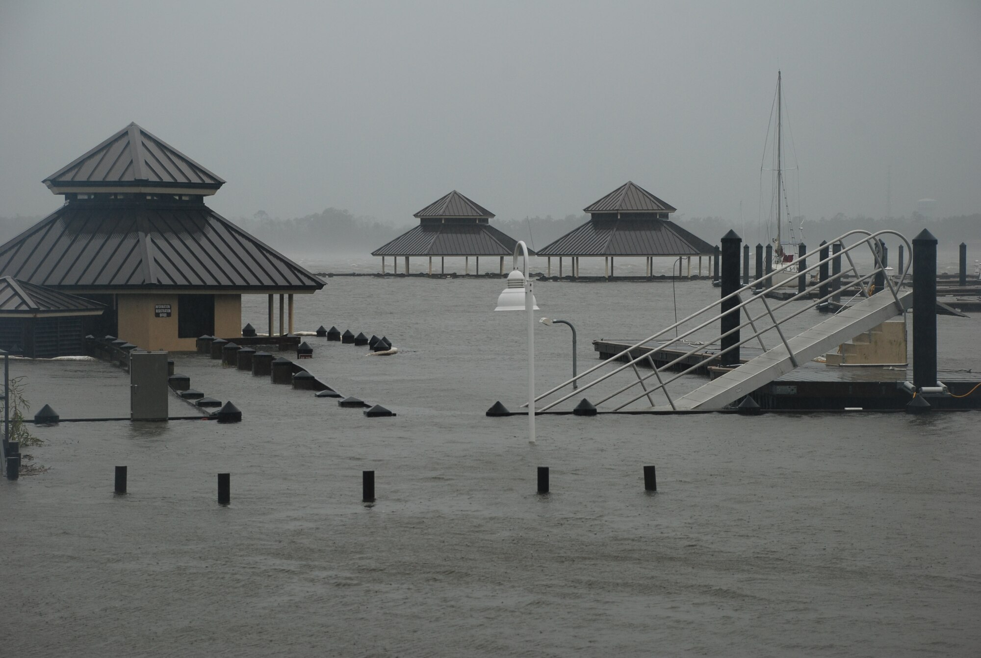 A storm surge in the Back Bay raises waters over the Keesler Marina’s docks. In an effort to ensure the safety of Keesler personnel and assets during Hurricane Isaac, the base was closed Aug. 28-29 and reopened Aug. 30 following minimal damage.  (U.S. Air Force photo by Staff Sgt. Kimberly Rae Moore)