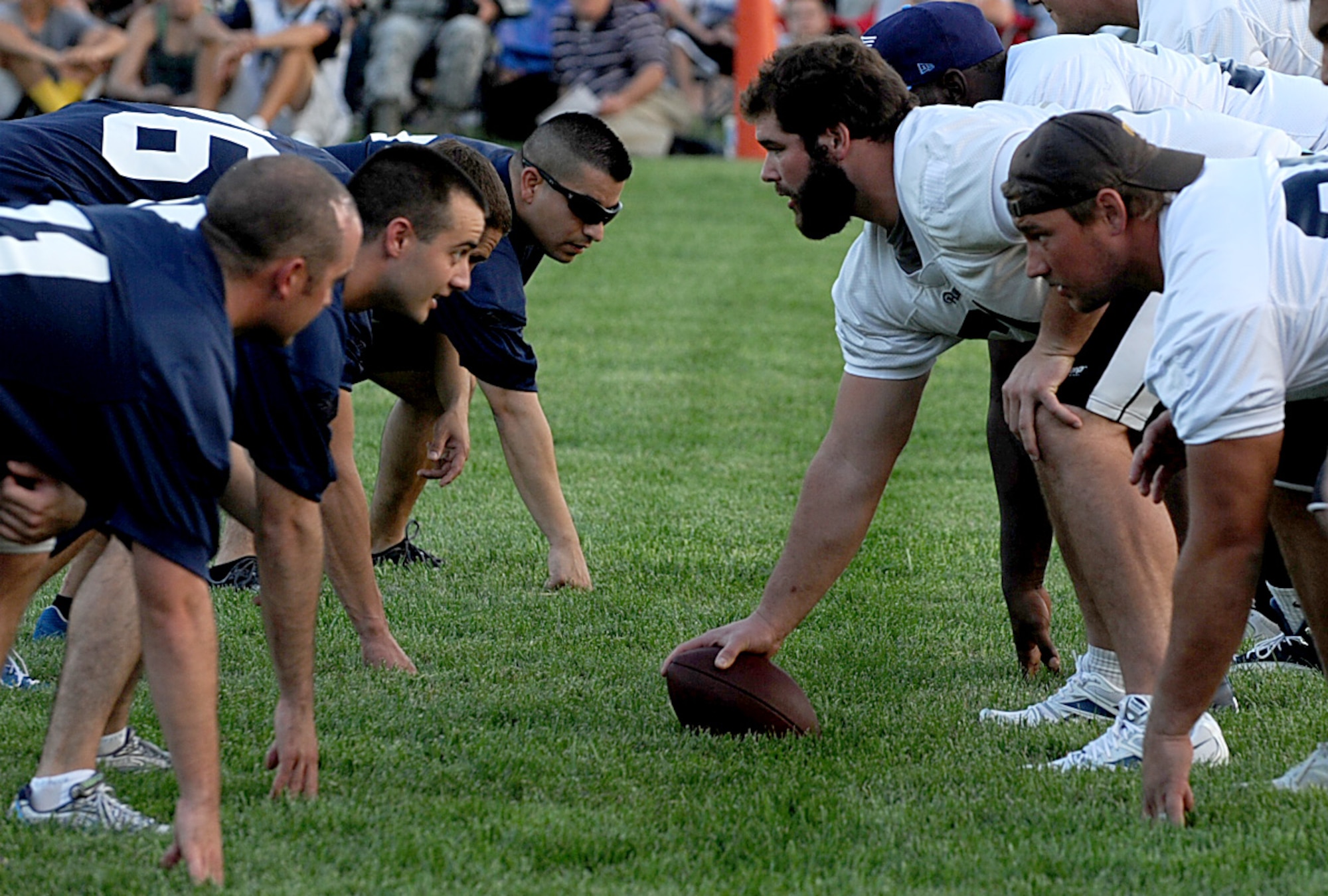 Team Scott members line up face to face against the St. Louis Rams offensive linemen during a walk through practice Aug. 29 at Scott Air Force Base, Ill. The Rams perform a walk through practice prior to each game to help them prepare mentally for their opponent on game day. (U.S. Air Force photo/ Staff Sgt. Brian J. Valencia)