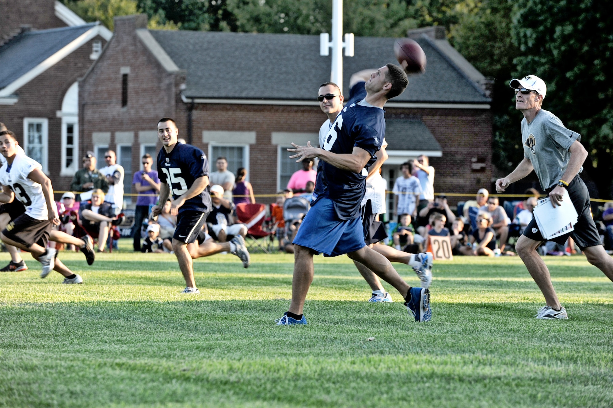 Team Scott members throw off to the St. Louis Rams special teams unit during a walk through practice Aug. 29 at Scott Air Force Base, Ill. Military members received a rare opportunity to play in a practice walk through against professional football players. (U.S. Air Force photo/Staff Sgt. Brian J. Valencia)
