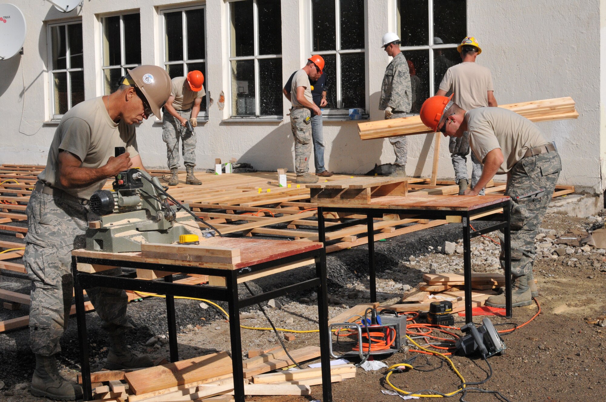 Wyoming Air National Guard Airmen assigned to the 153rd Civil Engineer Squadron complete decking at the recreation center site at the NATO School Aug. 24, 2012, in Oberammergau, Germany. Airmen from the 153rd CES are putting their skills to work as they conduct their annual training. (U.S. Air Force photo by Tech. Sgt. Natalie Stanley)