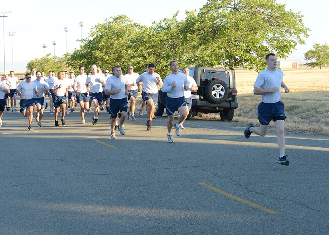 Airman 1st Class Derek Gwin, 9th Reconnaissance Wing civil law paralegal, takes an early lead in the Wing Champions Run August 30, 2012 at Beale Air Force Base, Calif. Gwin finished first in the two mile run with time of 10:15. The Wing Champions Run began immediately before the wing’s formation run and consisted of seven runners competing from each group. (U.S. Air Force Photo by Mr. John Schwab/ Released)