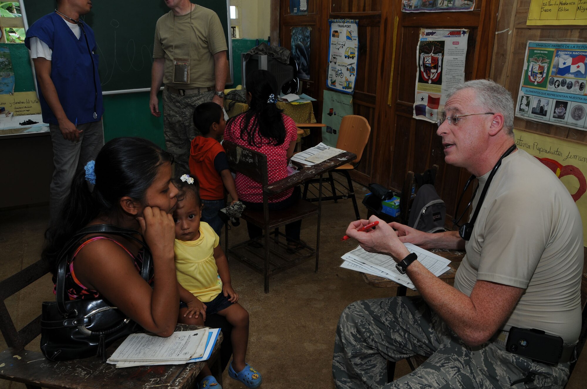 WRIGHT-PATTERSON AIR FORCE BASE, Ohio - Col. Brad Goldman, 445th Aerospace Medicine Squadron flight surgeon, reviews a patient's health forms at Panama's Ministry of Education C.E.B.G. Manuel J. Rodriguez School located in Tecue, Coclé District in Panama. Thirty Airmen from the 445th AMDS and 445th Aeromedical Staging Squadron traveled to Central America with Airmen from March Air Reserve Base, Calif., Joint Base Lewis-McChord, Wash., Robins Air Force Base, Ga., Niagara Falls Air Reserve Station, N.Y., and Westover Air Reserve Base, Mass., in Central America as part of a humanitarian mission to support Panama Medical Readiness Training Exercise (MEDRETE) Aug. 18 to Aug. 31, providing more than 9,000 dental, dermatological, general medicine, optometry and ophthalmology services to more than 5,000 residents living in remote areas who have limited or no access to medical care. (U.S. Air Force photo/Tech. Sgt. Anthony G. Springer)