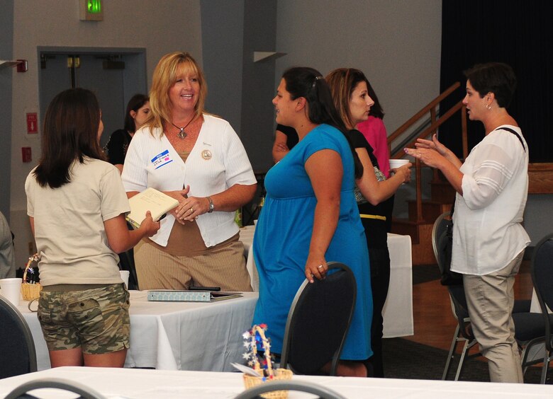 Members of Beale's key spouse program discuss ways to improve their organization at the Community Activity Center Beale Air Force Base Calif., August 29, 2012. Key spouses act as a liaison to disseminate information from squadron leadership to dependents. (U.S. Air Force photo by Senior Airman Allen Pollard)