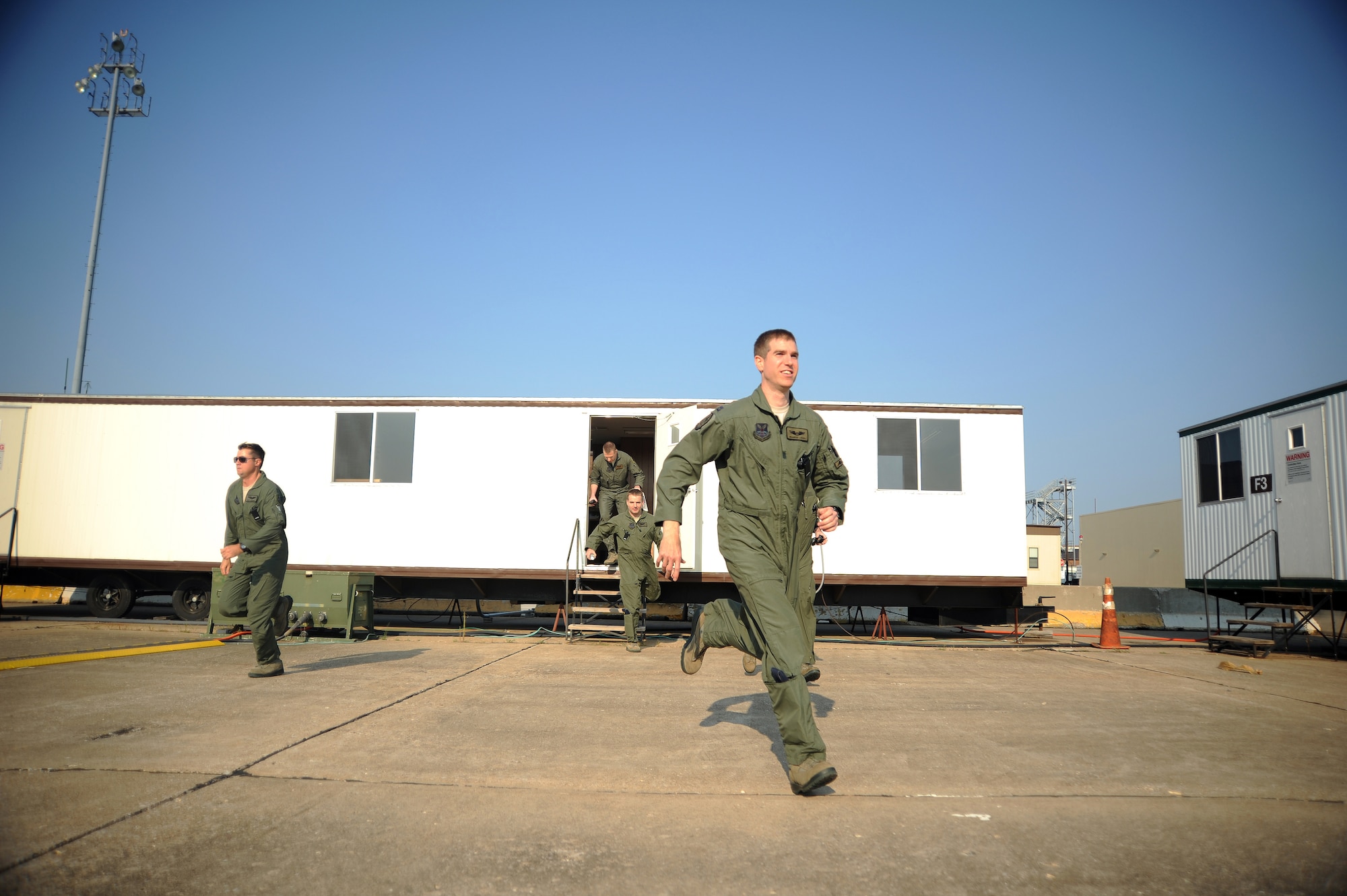 Pilots from the 509th Bomb Wing respond to an alert call in support of a nuclear operational readiness exercise Aug. 29, held at Whiteman Air Force Base, Mo. The NORE exercises alert calls to prepare aircrews to respond to real-world wartime emergencies. (U.S. Air Force photo/Senior Airman Nick Wilson) (Released)
