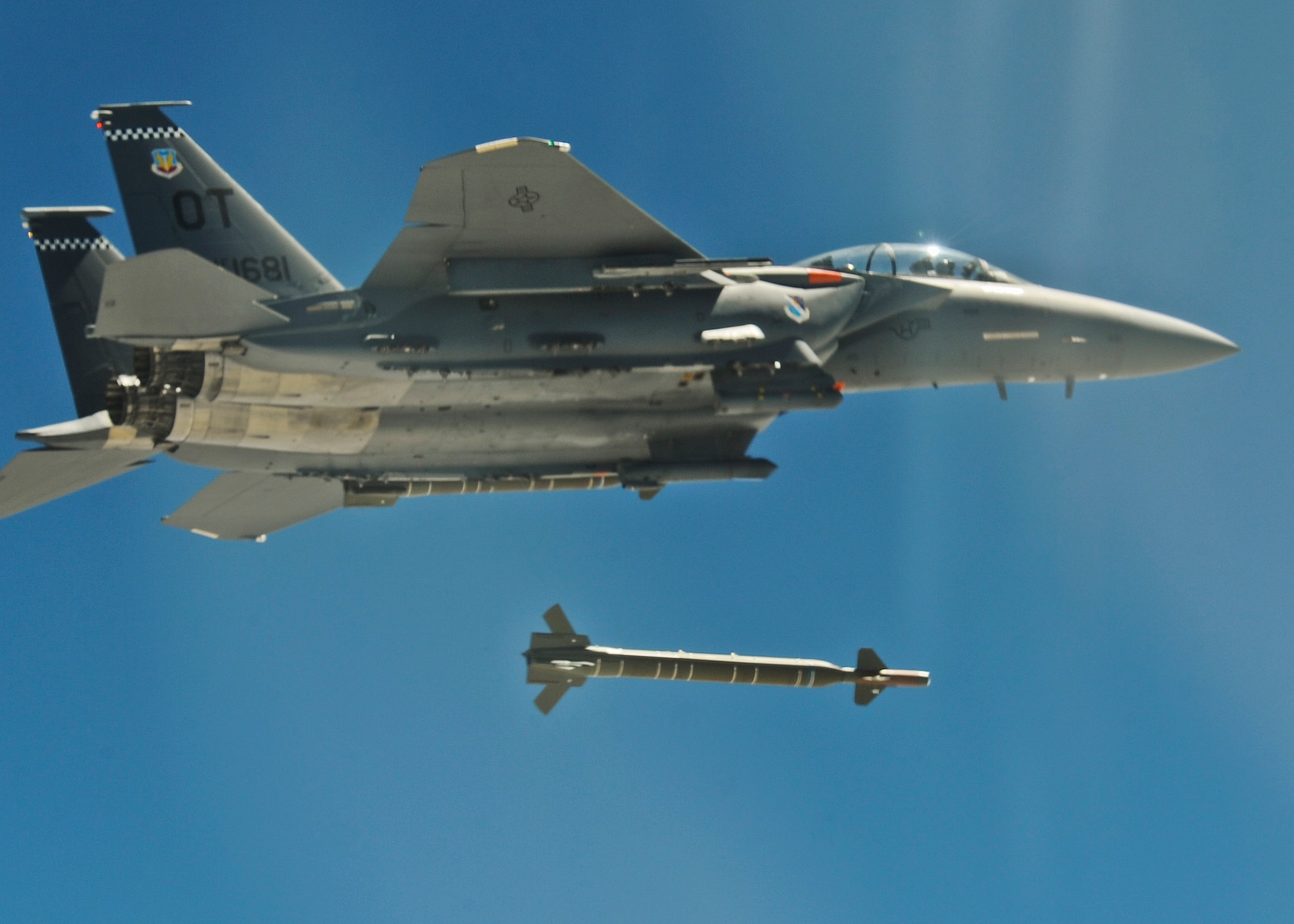 An F-15 from the 85th Test and Evaluation Squadron drops a guided bomb unit during a Combat Hammer mission at Hill Air Force Base, Utah. The 85th TES is part of the 53rd Wing located at Eglin Air Force Base, Fla.  The Combat Hammer missions were part of an annual month-long weapons system evaluation program held at the base by the 53rd Weapons Evaluation Group.  The group is responsible for air-to-ground and air-to-air weapons evaluation for the Air Force.  The air-to-ground unit, known as Combat Hammer, is managed by the 86th Fighter Weapons Squadron, located at Eglin.  The air-to-air unit, known as Combat Archer, is managed by the 83rd Fighter Weapons Squadron, located at Tyndall AFB, Fla. (Courtesy photo)