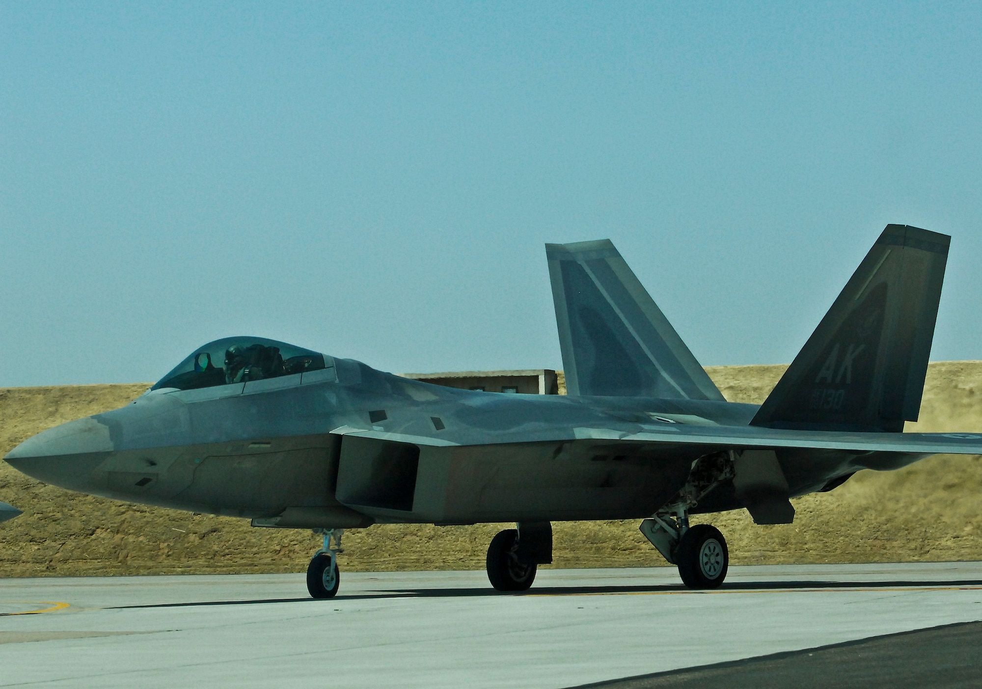 An F-22 Raptor from Elmendorf Air Force Base, Alaska, flies prepares for take-off for a Combat Hammer mission at Hill Air Force Base, Utah. The Combat Hammer missions were part of an annual month-long weapons system evaluation program held at the base by the 53rd Weapons Evaluation Group. The group is responsible for air-to-ground and air-to-air weapons evaluation for the Air Force.  The air-to-ground unit, known as Combat Hammer, is managed by the 86th Fighter Weapons Squadron, located at Eglin.  The air-to-air unit, known as Combat Archer, is managed by the 83rd Fighter Weapons Squadron, located at Tyndall AFB, Fla. (Courtesy photo)