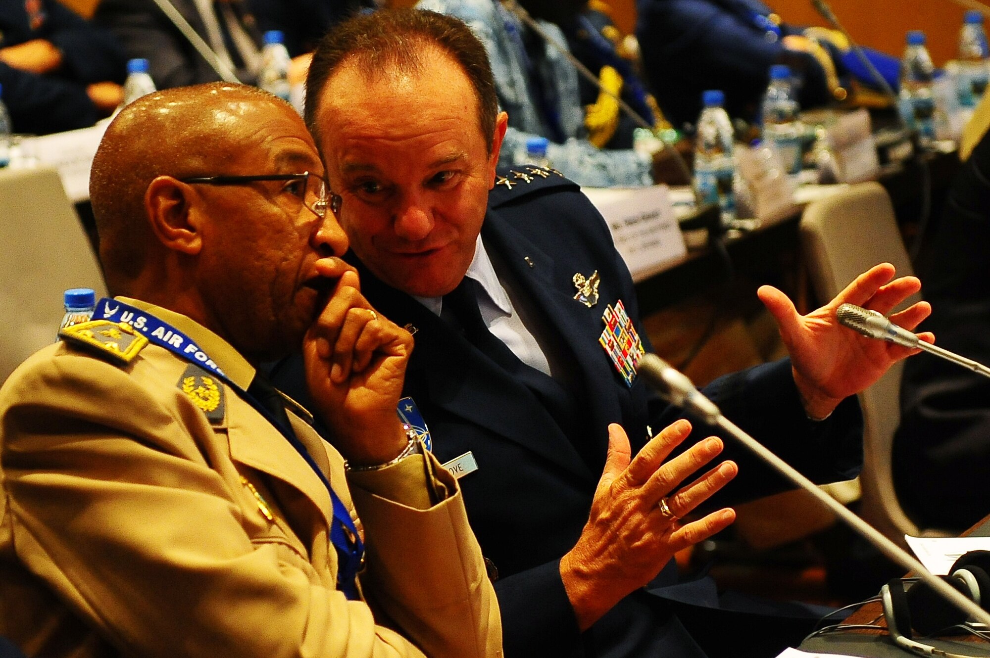 Gen. Philip Breedlove, U.S. Air Forces in Europe and Air Force Africa commander speaks with Brig. Gen. Alain Pereira, Senegal air chief, during a group discussion at the Regional Air Chief Conference in Dakar Senegal, Aug. 29, 2012. The conference focused on promoting regional partnerships in Northern and Western Africa and to help find African solutions to African problems. (U.S. Air Force photo/Staff Sgt. Travis Edwards) 