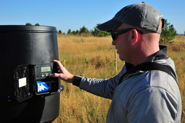 Steven Selser, 92nd Civil Engineer Squadron natural and cultural resources manager, checks a feeder in hunting zone three at Fairchild Air Force Base, Wash., Aug. 23, 2012. The hunting zones are at Fairchild’s nature trail located near the Survival Evasion Resistance and Escape side of the base. In the feeders are corn, wheat and oats.    (U.S. Air Force photo by Airman 1st Class Earlandez Young)