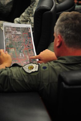 A Fairchild Lt. Col. browses a map indicating hunting zones for this year’s archery season Aug. 21, 2012, in the Civil Engineer Squadron’s conference room. Potential hunters must possess all required Washington State deer hunting licenses and tags in addition to a $10 base-issued permit, which goes to the Department of Defense’s fish and wildlife fund. Proceeds go directly back to the base it’s received from. (U.S. Air Force photo by Airman 1st Class Earlandez Young)