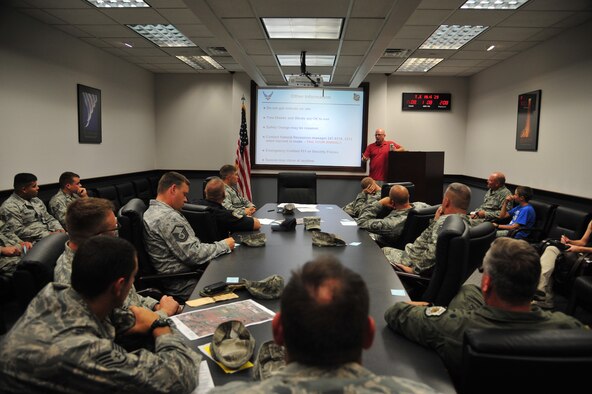 Members of Team Fairchild lock eyes on Steven Selser, 92nd Civil Engineer Squadron natural and cultural resources manager, as he discusses additional information about this year’s archery hunting season Aug. 21, 2012, in the CE conference room. Archery season is open for white-tailed and mule deer Sept. 1 to 28. (U.S. Air Force photo by Airman 1st Class Earlandez Young)