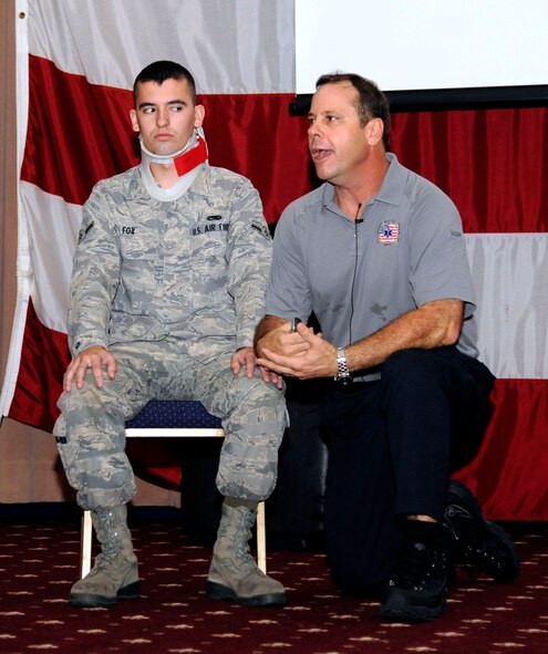 Airman Dylan Fox, 2nd Maintenance Squadron, takes part in a Street Smart demonstration with Ralph Jimenez, Miami-Dade Fire Rescue firefighter and paramedic, at Hoban Hall on Barksdale Air Force Base, La., Aug 30. The demonstration gave examples of what kinds of trauma a person would go through if they drive a vehicle without wearing a seatbelt. (U.S. Air Force photo/Airman 1st Class Andrew Moua)(RELEASED)