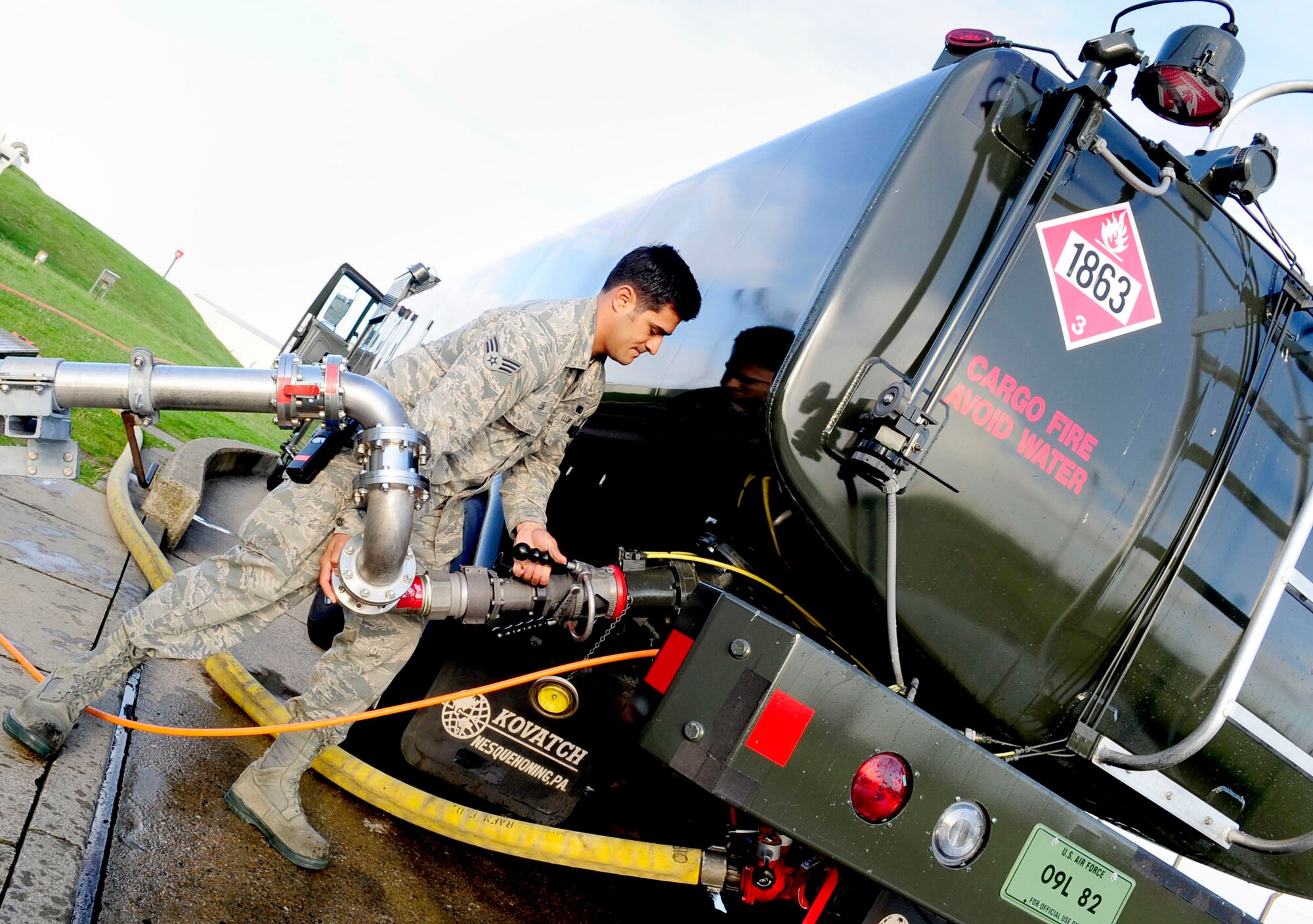 RAF MILDENHALL, England – Senior Airman Andrew Leal, 100th Logistics Readiness Squadron fuels technician, attaches a pantograph fuel dispenser to a fuel truck during a major accident response exercise Aug. 30, 2012, at RAF Mildenhall. The MARE helps to familiarize Team Mildenhall personnel on how to handle a major fuel spill. (U.S. Air Force photo/Senior Airman Ethan Morgan)