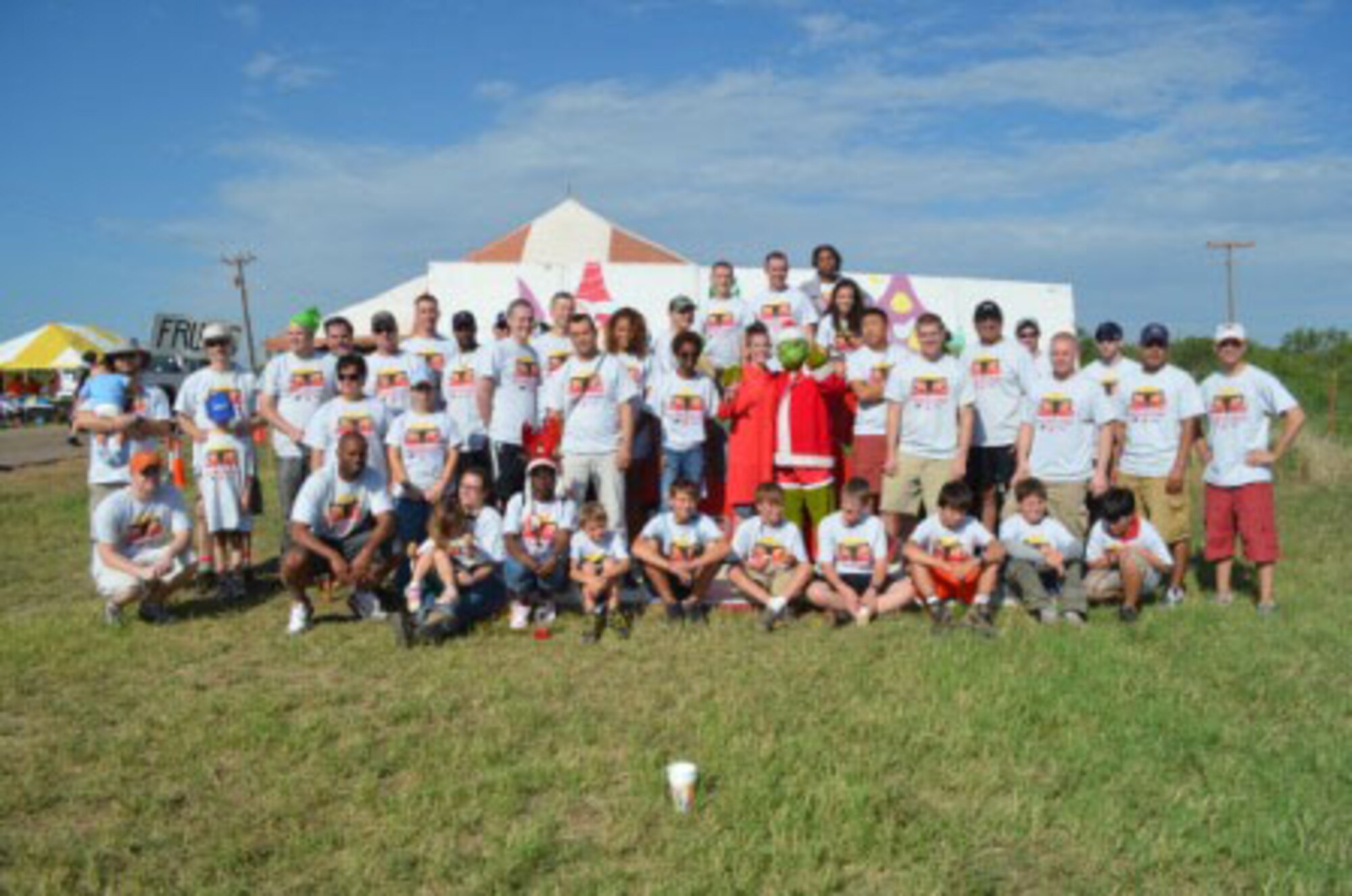 Members of the 363rd Training Squadron from Sheppard Air Force Base, Texas, pose with members of Boy Scout Troop 13 during the 31st annual Hotter N' Hell bike race Aug. 25, 2012.  The 363rd TRS and the Boy Scout troop teamed up to run one of the race's pit stops near Electra, Texas. (U.S. Air Force courtesy photo)