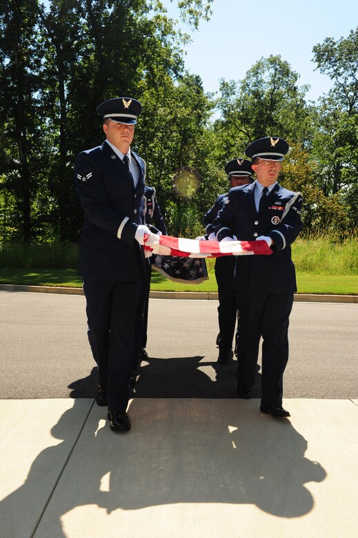 Members of the Maxwell Air Force Base Honor Guard perform a memorial ceremony held Aug. 22, 2012 at the Alabama National Cemetary in Montevallo Ala. Although Mr. was U.S. Naval veteran, Honor Guard Airmen participate in joint service funerals around the globe. (U.S. Air Force photo by Master Sgt. Michael Voss) 