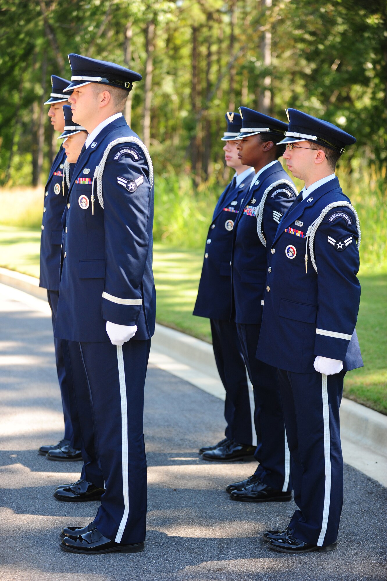 Members of the Maxwell Air Force Base Honor Guard perform a memorial ceremony held Aug. 22, 2012 at the Alabama National Cemetary in Montevallo Ala. Although Mr. was U.S. Naval veteran, Honor Guard Airmen participate in joint service funerals around the globe. (U.S. Air Force photo by Master Sgt. Michael Voss) 