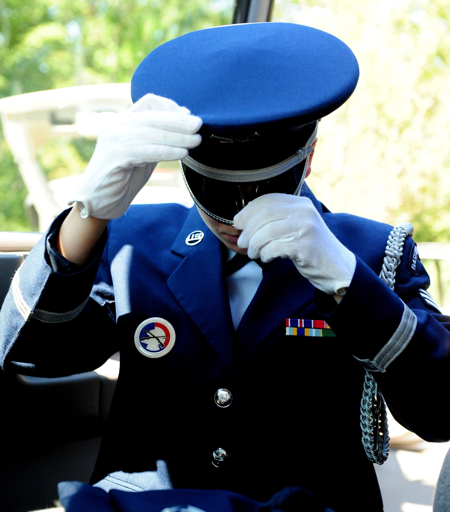 Senior Airman Emily Harris, member of the Maxwell Air Force Base Honor Guard prepares to perform a memorial ceremony held Aug. 22, 2012 at the Alabama National Cemetary in Montevallo Ala. Although Mr. was U.S. Naval veteran, Honor Guard Airmen participate in joint service funerals around the globe. (U.S. Air Force photo by Master Sgt. Michael Voss) 