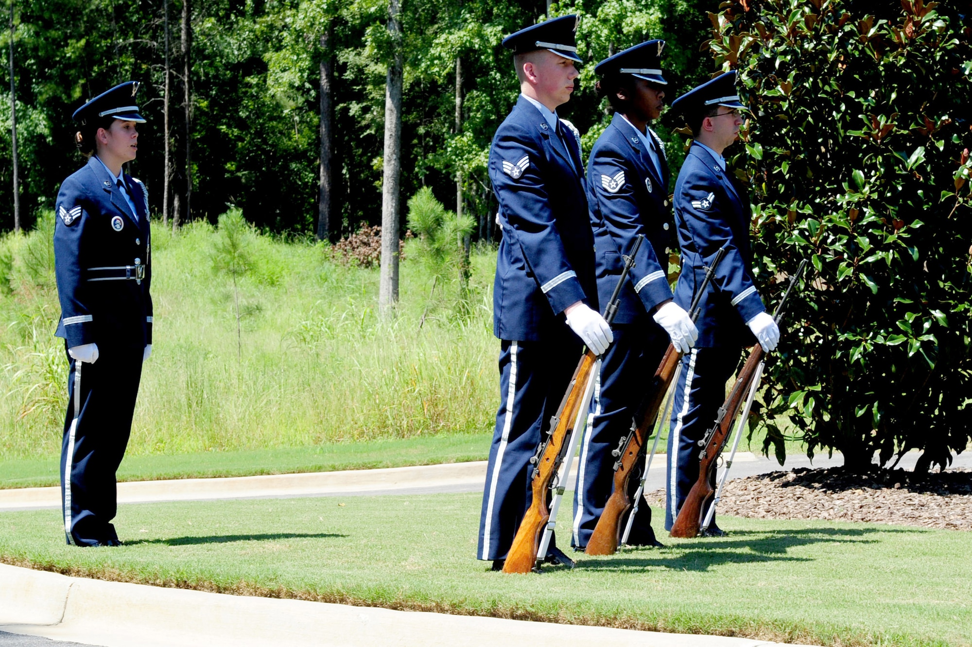 Members of the Maxwell Air Force Base Honor Guard perform a memorial ceremony held Aug. 22, 2012 at the Alabama National Cemetary in Montevello, Ala. (U.S. Air Force by Master Sgt. Michael Voss)