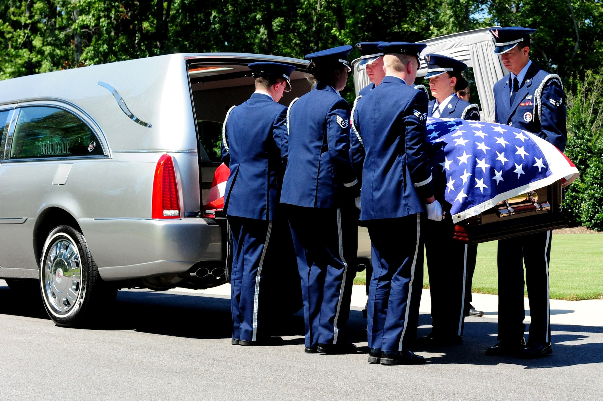 Members of the Maxwell Air Force Base Honor Guard perform a memorial ceremony held Aug. 22, 2012 at the Alabama National Cemetary in Montevallo Ala. Although Mr. was U.S. Naval veteran, Honor Guard Airmen participate in joint service funerals around the globe. (U.S. Air Force photo by Master Sgt. Michael Voss) 