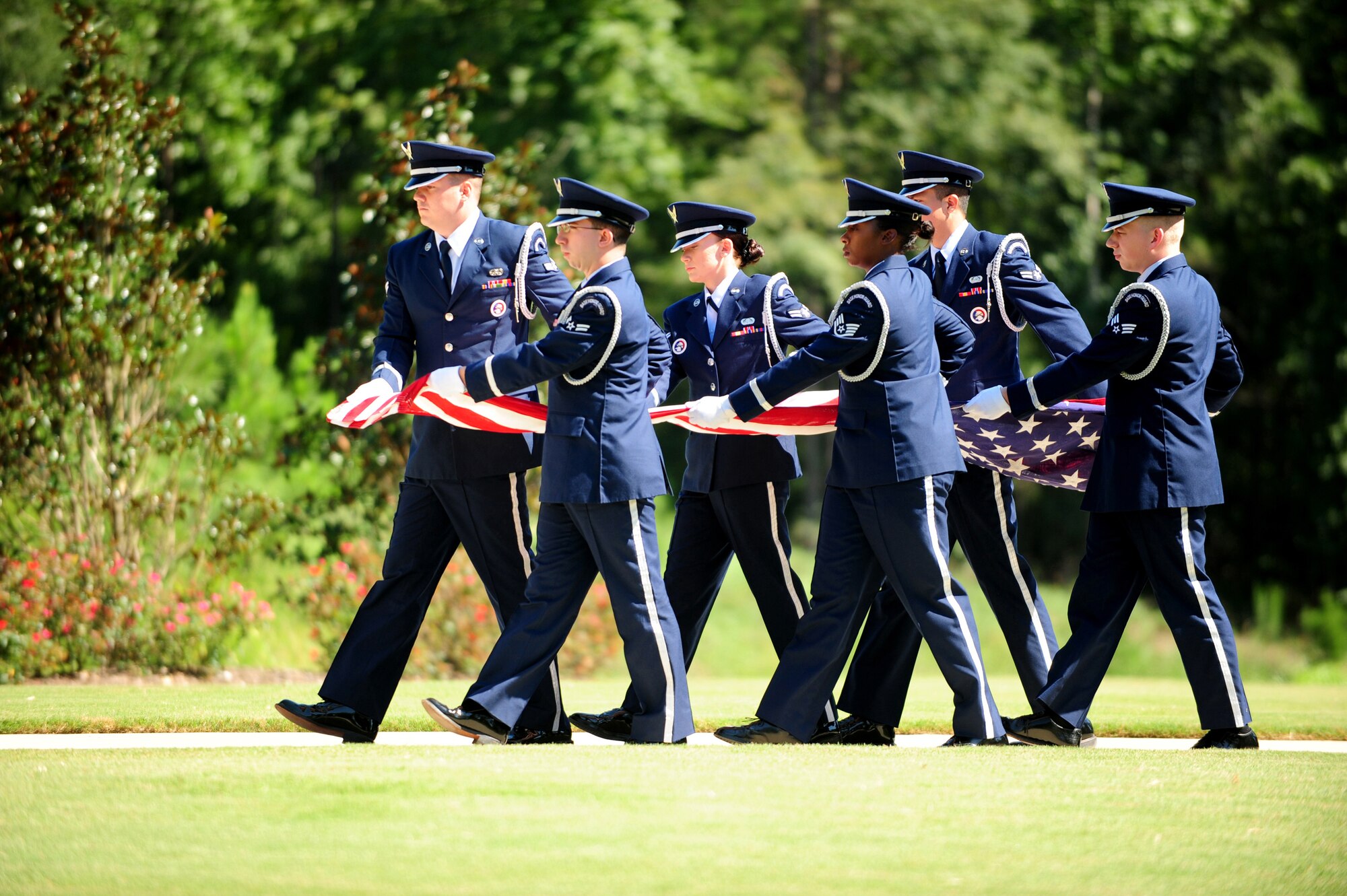 Members of the Maxwell Air Force Base Honor Guard perform a memorial ceremony held Aug. 22, 2012 at the Alabama National Cemetary in Montevallo Ala. Although Mr. was U.S. Naval veteran, Honor Guard Airmen participate in joint service funerals around the globe. (U.S. Air Force photo by Master Sgt. Michael Voss) 