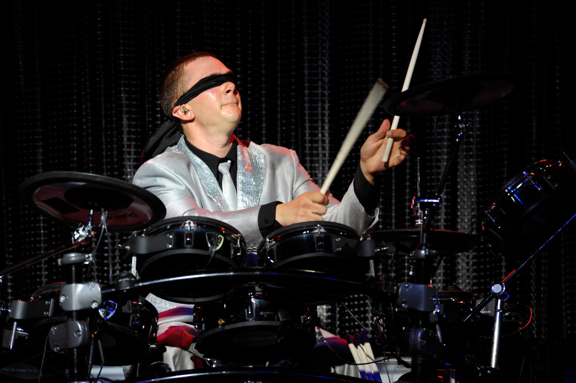 DENVER -- Tech. Sgt. Joshua Tarrant, 460th Operations Group Detachment 1, Buckley Air Force Base, Colo., performs blindfolded during his drum solo Aug. 28. Tarrant will be playing drums over the next year for the Tops in Blue "Listen" tour. (U.S. Air Force photo by Staff Sgt. Kathrine McDowell)