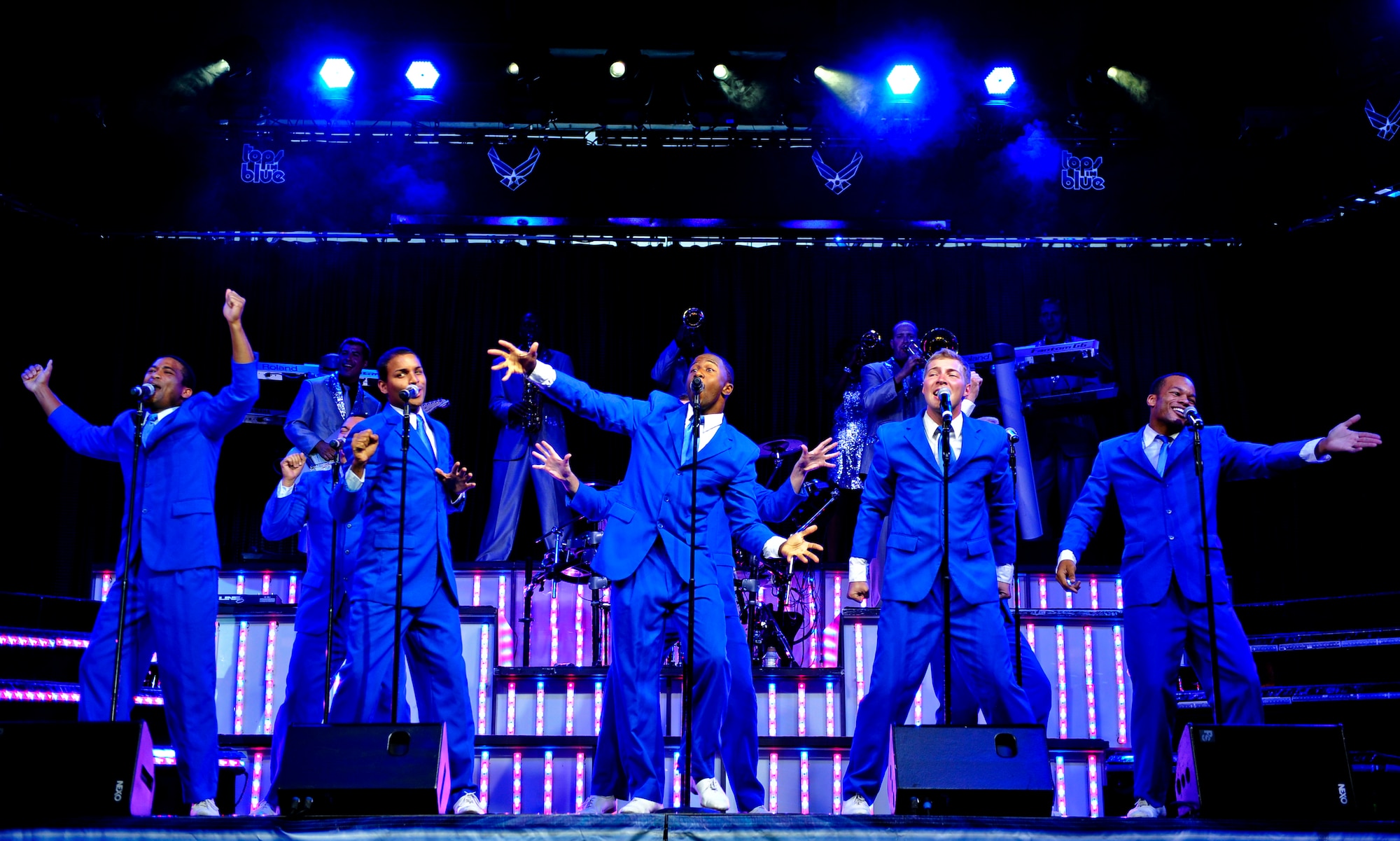 DENVER -- Tops in Blue vocalists take the stage for their first number at the Wings Over the Rockies Air and Space Museum Aug. 28. Tops in Blue has been performing for military personnel and their families for nearly 60 years. (U.S. Air Force photo by Staff Sgt. Kathrine McDowell)