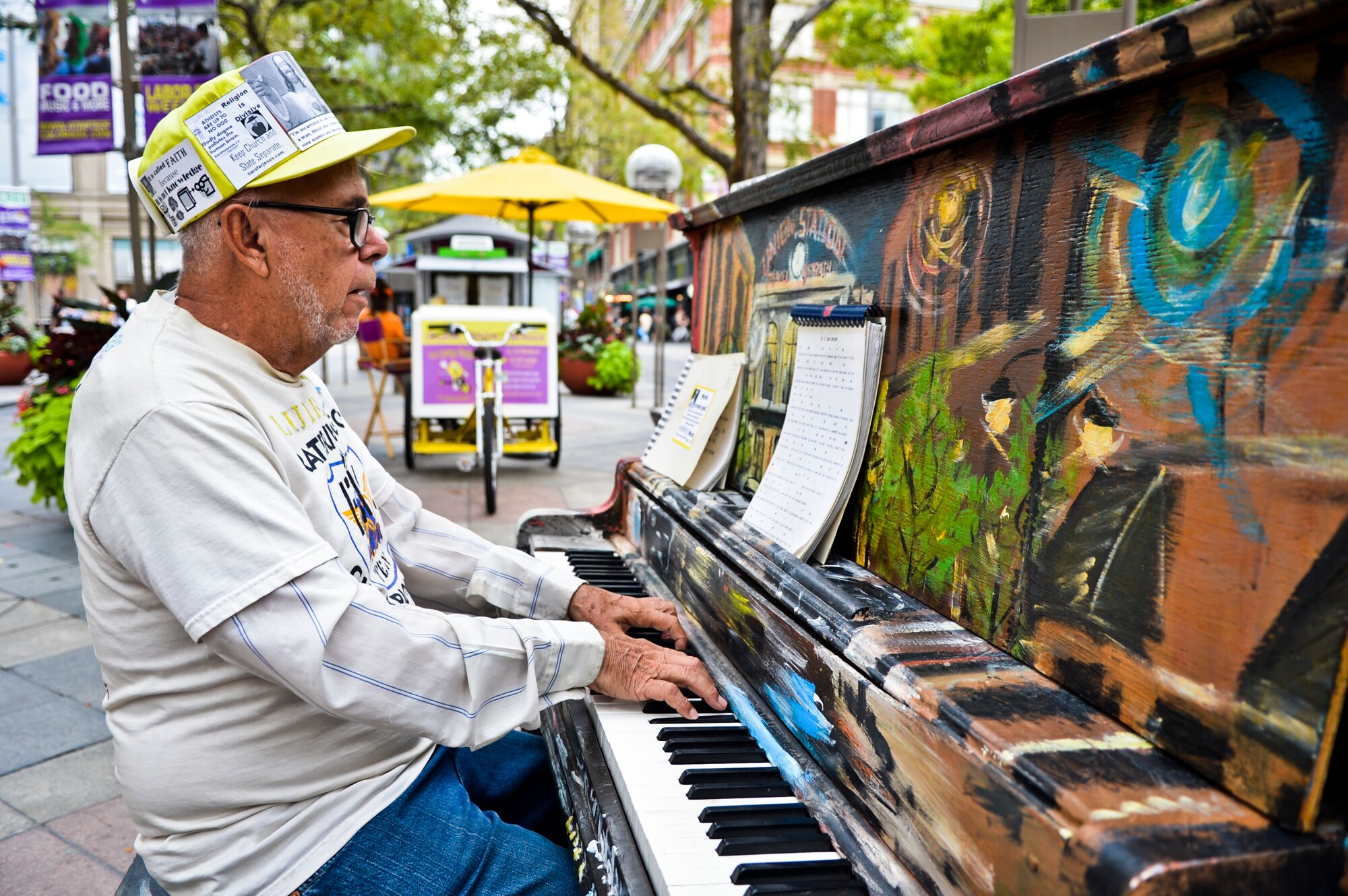 DENVER -- Richard Grimes plays a tune on one of the many pianos open for use to everyone in the downtown Denver area on Aug. 23, 2012. All along the 16th Street Mall shopping area there are many free attraction open to public use such as chess boards. (U.S. Air Force photo by Paul Labbe)
