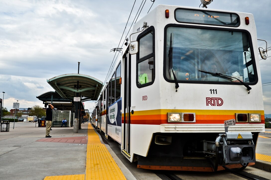DENVER -- A pedestrian waits to board a RTD train on Aug. 23, 2012.The Regional Transportation District Light Rail System is free to ride for all military individuals.  (U.S. Air Force photo by Paul Labbe)