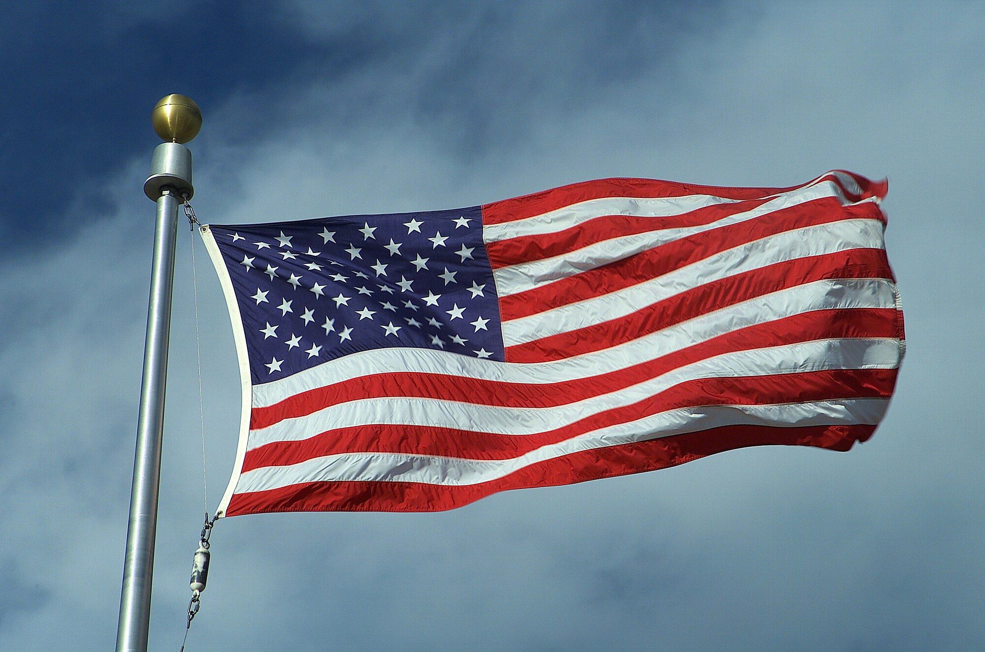 Throughout the day, and especially during reveille, retreat and taps, all personnel on base are expected to pay respect to the flag. (U.S. Air Force file photo)
