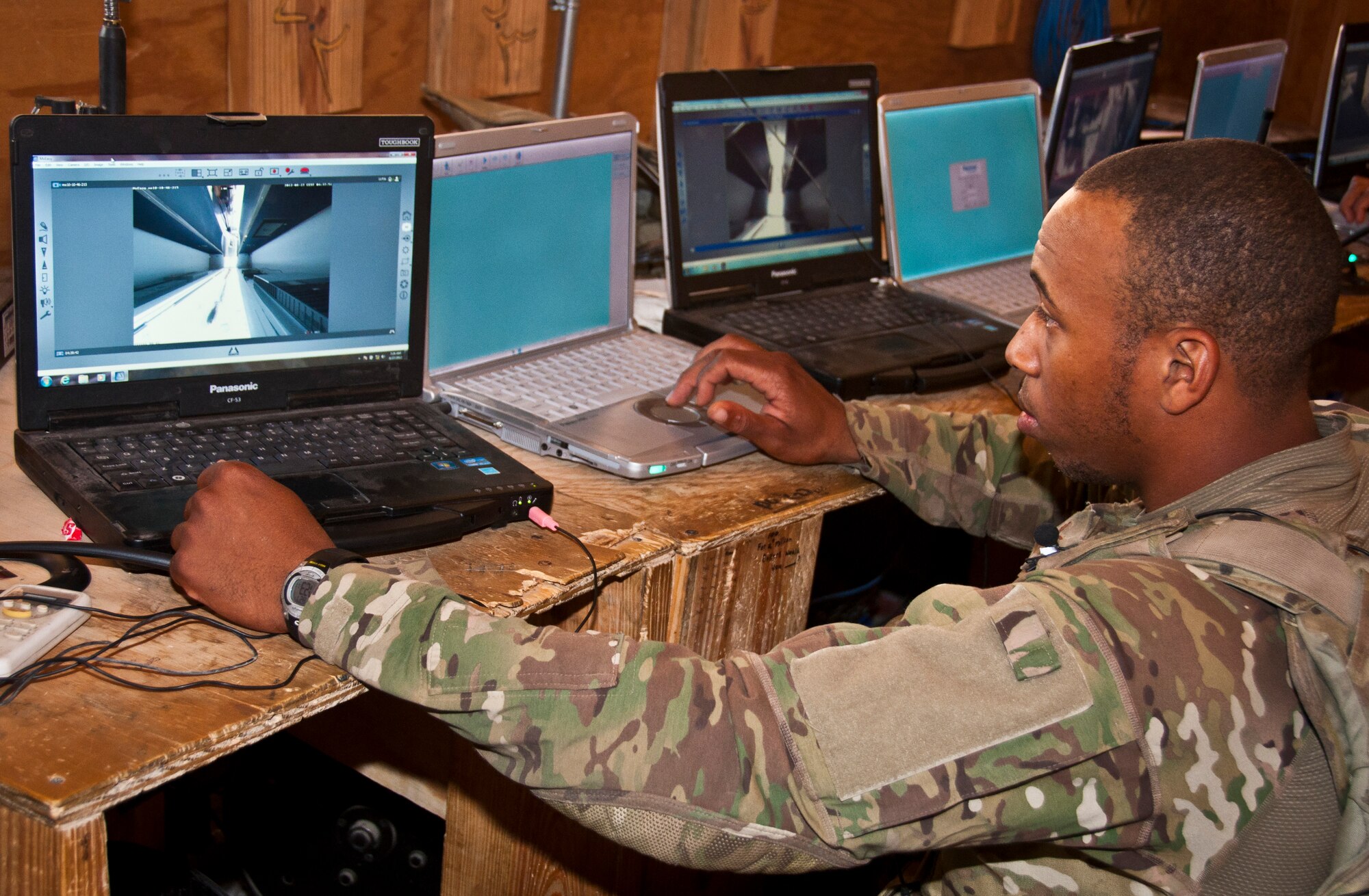 SrA Ryan Rucker, an Airman with the 455th Expeditionary Security Forces Squadron, reviews X-ray images of local nationals as they make their way through an entry control point at Bagram Airfield Afghanistan, Aug. 27, 2012. Bagram defenders utilize a combination of static and mobile teams to protect the base from outside threats. (U.S. Air Force Photo/TSgt Shawn McCowan)