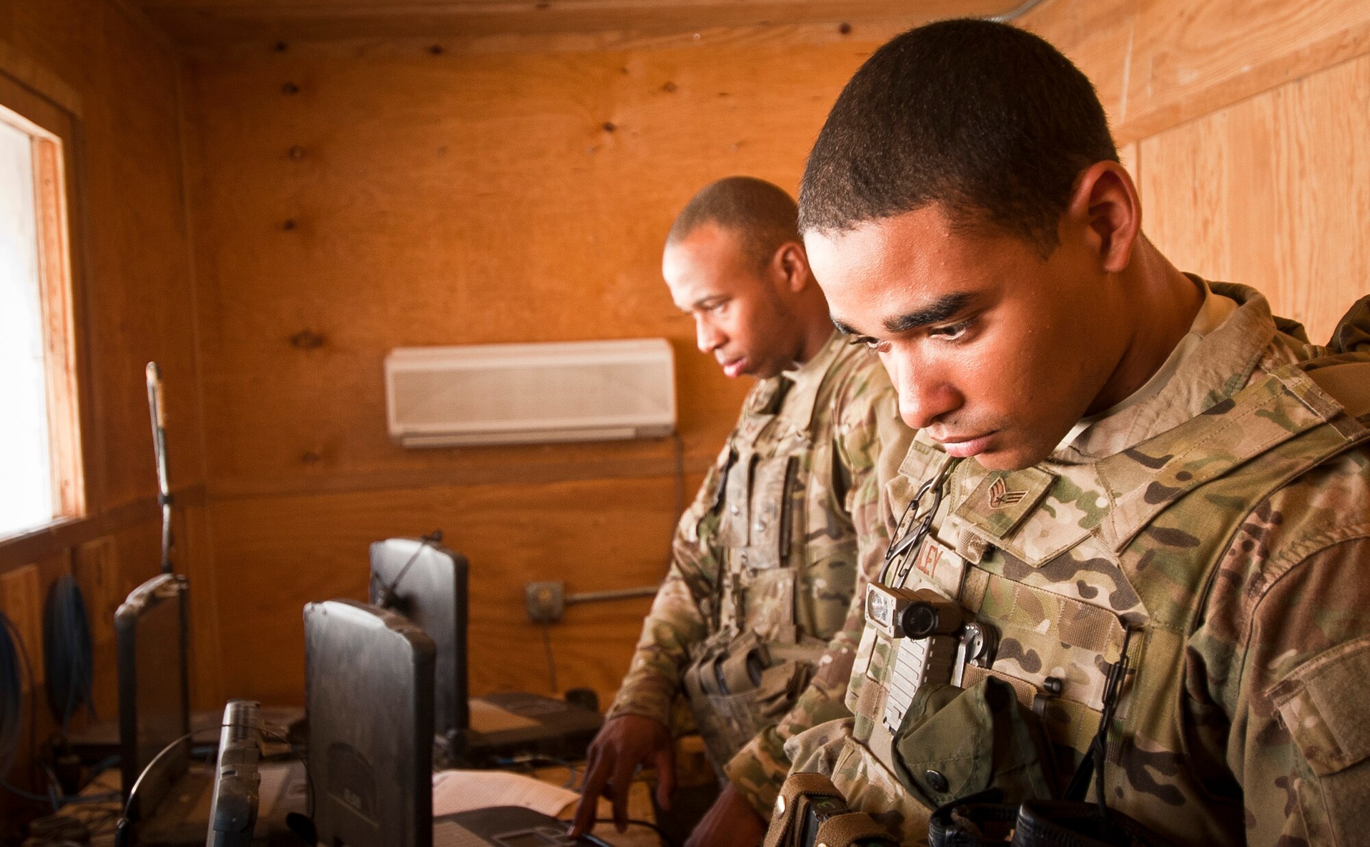 SrA Jared Bailey, an Airman with the 455th Expeditionary Security Forces Squadron, reviews x-ray images of local nationals as they go through an entry control point at Bagram Airfield Afghanistan, Aug. 18, 2012. Bagram defenders utilize a combination of static and mobile teams to protect the base from outside threats. (U.S. Air Force Photo/Capt. Raymond Geoffroy)