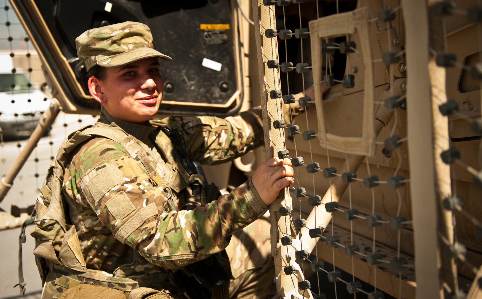 SrA Kayla Wadley, a truck driver with the 455th Expeditionary Security Forces Squadron, steps into her tactical vehicle before a mission at Bagram Airfield Afghanistan, Aug. 18, 2012. Wadely and her fellow defenders enable safe and secure operations at Bagram by maintaining a constant presence in and around the base to deter and defeat enemy attacks. (U.S. Air Force Photo/Capt. Raymond Geoffroy)