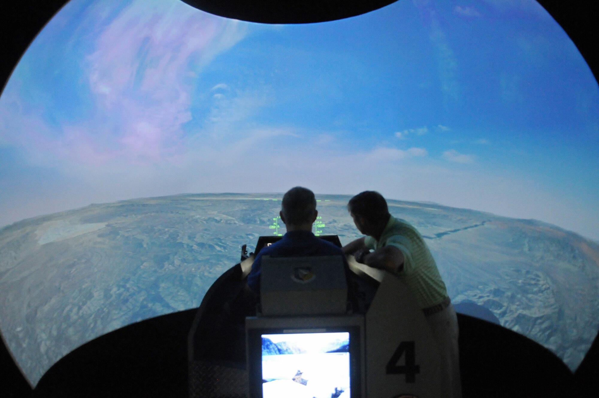 Retired Brig. Gen. Steve Ritchie, a former 555th Fighter Squadron member and ace pilot, flies a simulated jet at Aviano Air Base, Italy Aug. 28. Ritchie, who became an ace pilot Aug. 28, 1972, shot down two more aircraft during the simulation.(U.S. Air Force Photo/Airman 1st Class Matthew Lotz)