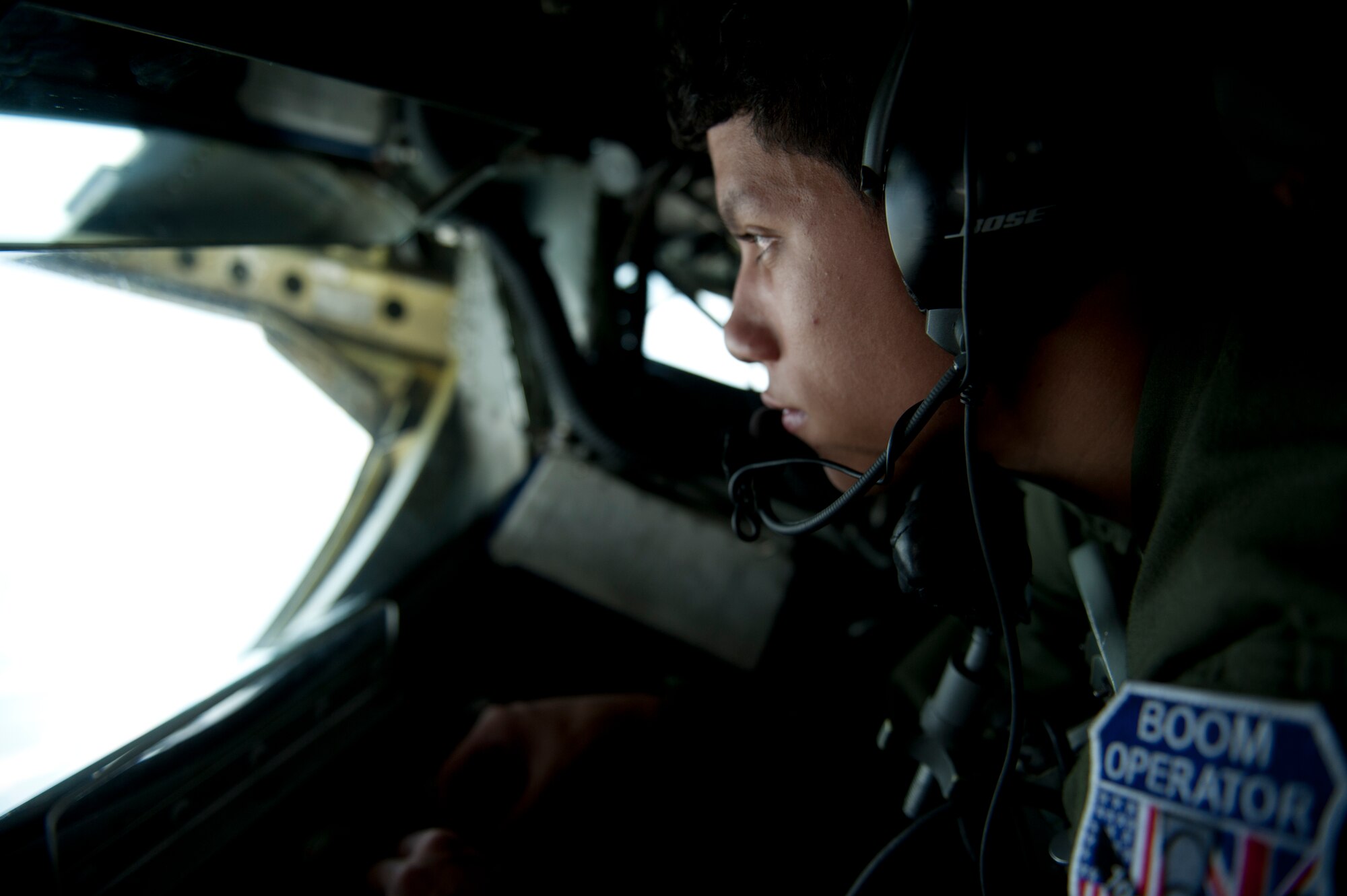 SPANGDAHLEM AIR BASE, Germany – Airman Anthony Ellsworth, 351st Air Refueling Squadron boom operator, moves a 351st ARS KC-135 Stratotanker refueling boom into place here Aug. 30 before an 81st Fighter Squadron A-10 Thunderbolt II can link up during an orientation flight for 52nd Fighter Wing spouses. The flight allowed spouses to get an up-close view of 81st FS aircraft from Spangdahlem AB during in-flight refueling. The 351st ARS and 52nd FW aircrew train together to enhance their interoperability to perform in-flight refueling missions. (U.S. Air Force photo by Airman 1st Class Dillon Davis/Released)