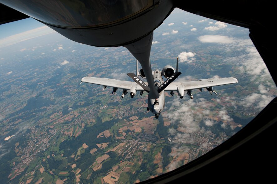 SPANGDAHLEM AIR BASE, Germany – An 81st Fighter Squadron A-10 Thunderbolt II receives fuel here Aug. 30 from a 351st Air Refueling Squadron KC-135 Stratotanker from Royal Air Force Mildenhall, England, during an orientation flight for 52nd Fighter Wing spouses. The flight allowed spouses to get an up-close view of 81st FS aircraft from Spangdahlem AB during in-flight refueling. The 351st ARS and 52nd FW aircrew train together to enhance their interoperability to perform in-flight refueling missions. (U.S. Air Force photo by Airman 1st Class Dillon Davis/Released)