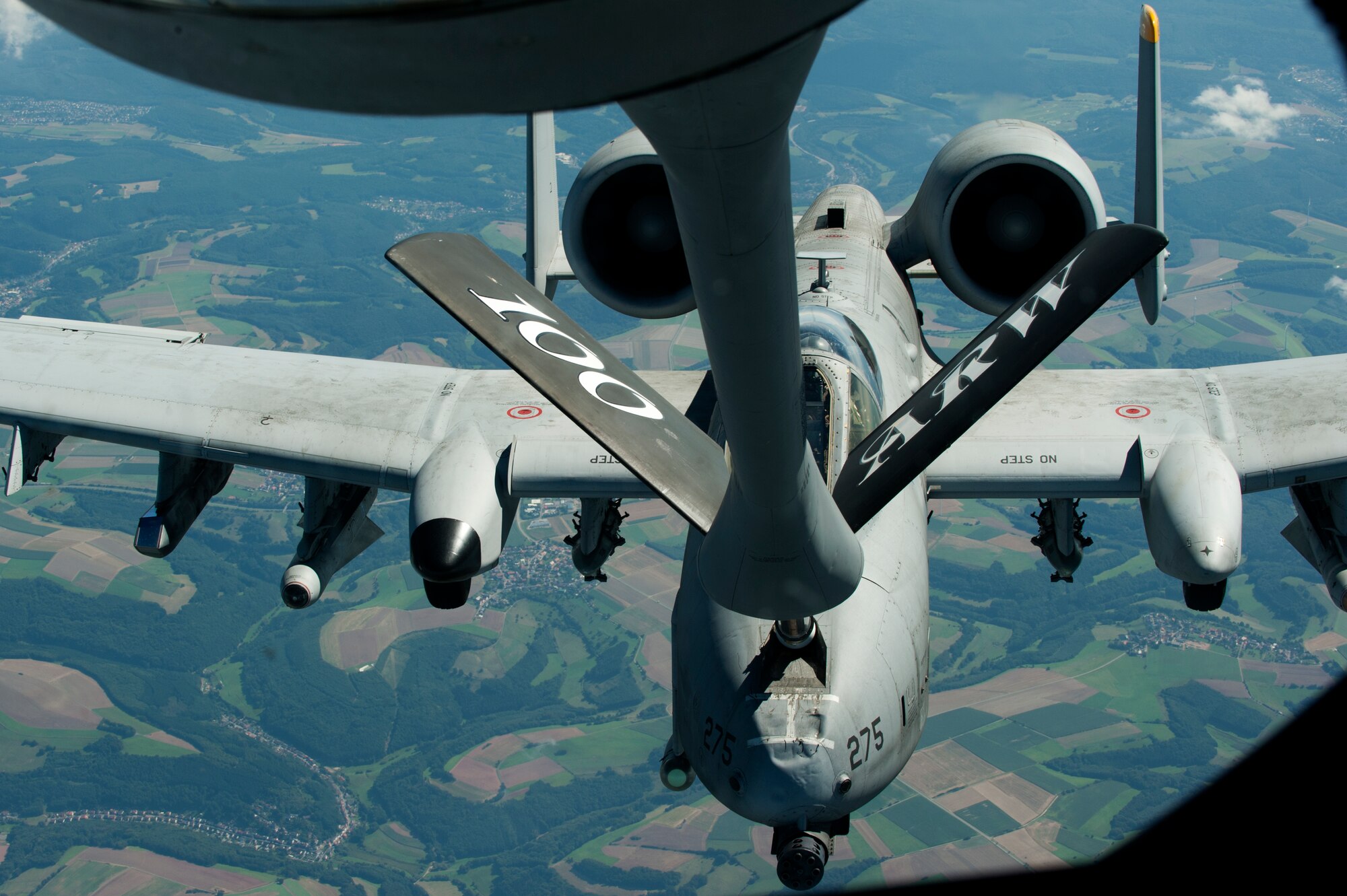 SPANGDAHLEM AIR BASE, Germany – An 81st Fighter Squadron A-10 Thunderbolt II receives fuel here Aug. 30 from a 351st Air Refueling Squadron KC-135 Stratotanker from Royal Air Force Mildenhall, England, during an orientation flight for 52nd Fighter Wing spouses. The flight allowed spouses to get an up-close view of 81st FS aircraft from Spangdahlem AB during in-flight refueling. The 351st ARS and 52nd FW aircrew train together to enhance their interoperability to perform in-flight refueling missions. (U.S. Air Force photo by Airman 1st Class Dillon Davis/Released)