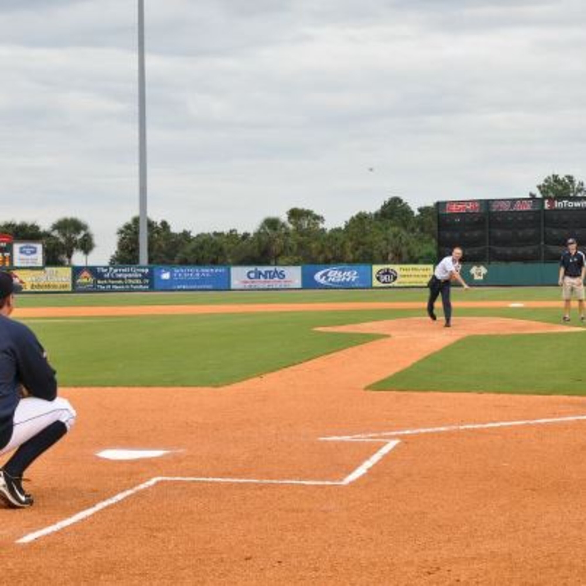 Incoming 315th Airlift Wing Commander, Col. Jamie Fontanella, throws out the first pitch  at the Charleston Riverdogs game Aug. 29. He was joined by Col. Dennis Dabney, 437th Maintenance Group commander, and Lt. Col. Michael Moyles, 628th Mission Support Squadron deputy commander. The Riverdogs invited the Joint Base Charleston leaders to help kick off the team's military appreciation night, which was rained out last week. (U.S. Air Force photo / Capt. Wayne Capps)