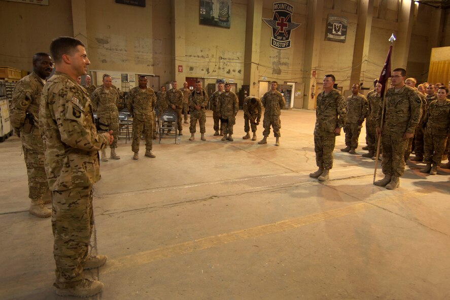 Maj. James Webb (left), a Critical Care Nurse assigned to the U.S. Army’s 966th Forward Surgical Team, Task Force-Medical Alpha, addresses his unit after being presented with the Purple Heart at Bagram Airfield, Afghanistan, Aug. 28, 2012. Webb was serving as part of the medical evacuation crew in the central Ghazni Province of Afghanistan when he was shot by an enemy AK-47 while loading a patient aboard his helicopter. (U.S. Air Force photo/Staff Sgt. Jeff Nevison) 

