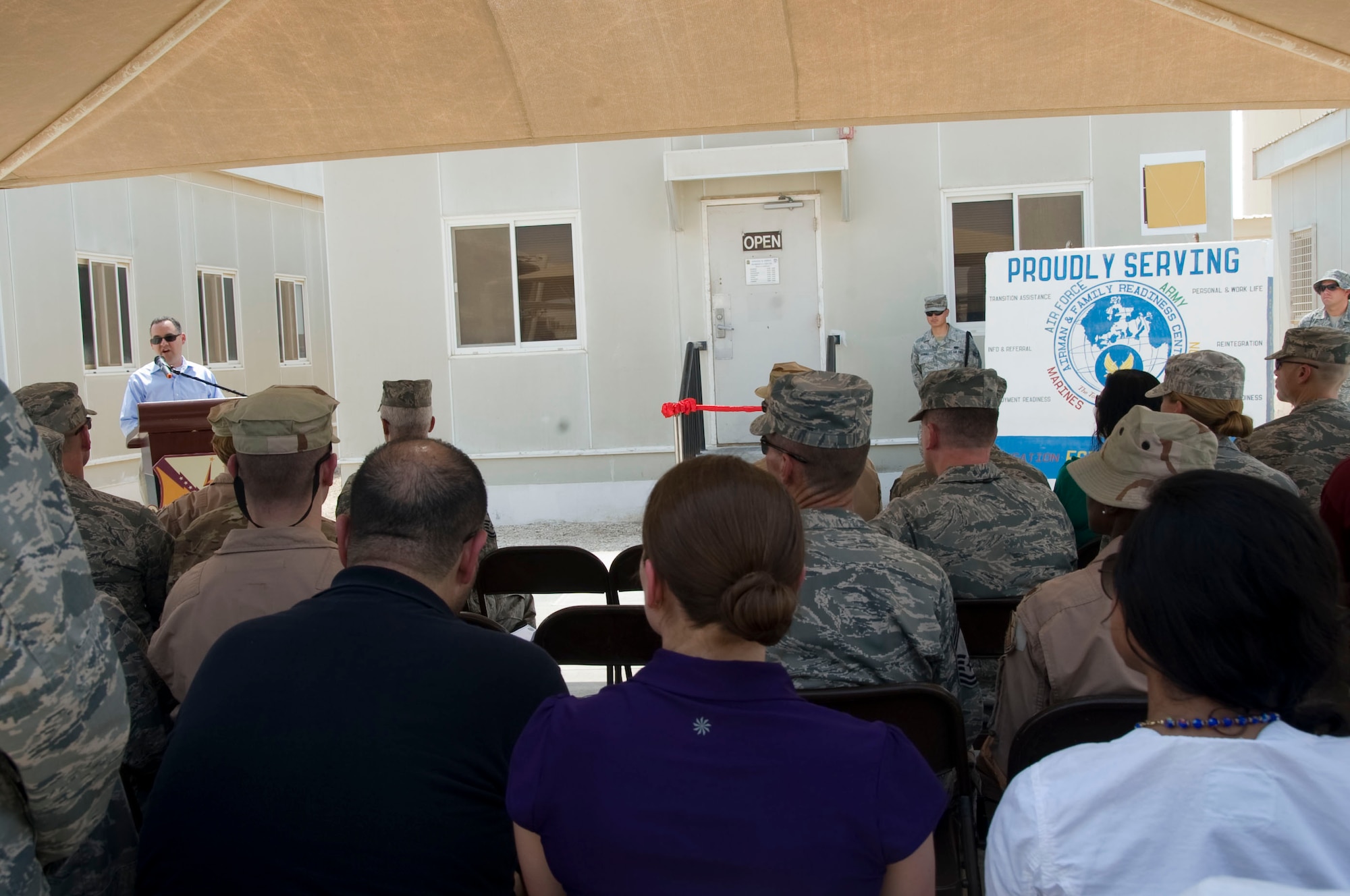Mr. Daniel Ginsberg, Assistant Secretary of the Air Force for Manpower and Reserve Affairs, speaks to 379th Air Expeditionary Wing members and families during the renaming ceremony of the Airman Family Readiness Center, August 29, 2012. Mr.Ginsberg is responsible for providing overall supervision of manpower, military and civilian personnel, Reserve component affairs, and readiness support for the Department of the Air Force. (U.S. Air Force photo/Staff Sgt. Sheila deVera)

