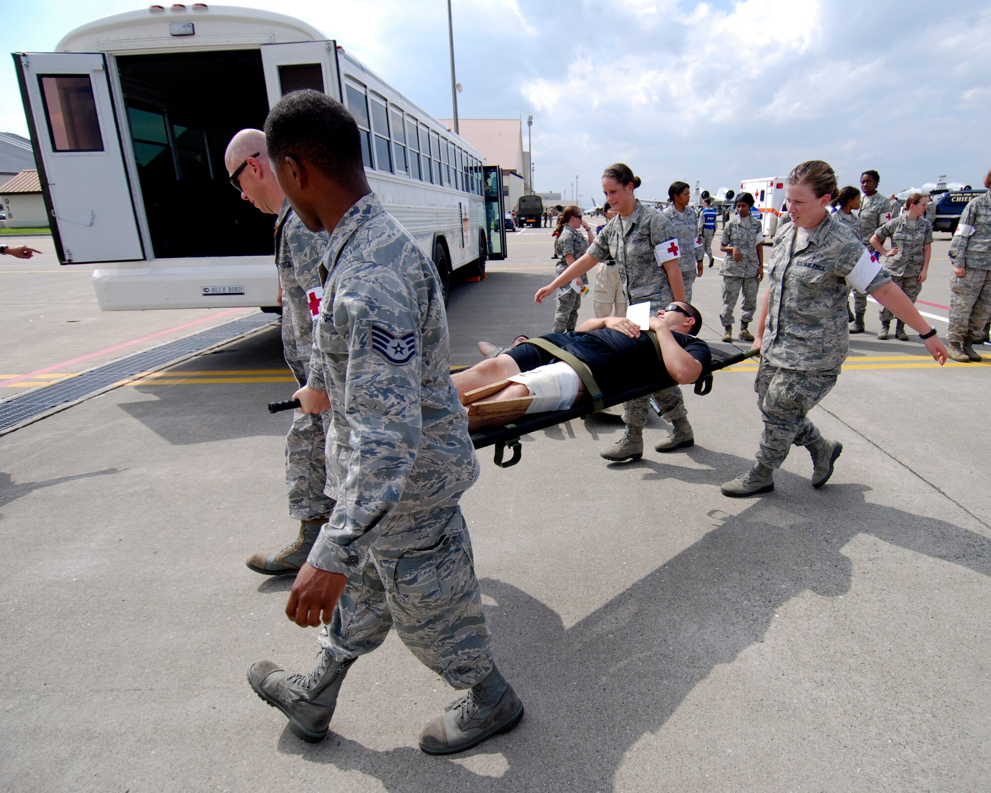 U.S. Air Force emergency responders from the 35th Medical Group evacuate a simulated casualty during a major accident response exercise (MARE) at Misawa Air Base, Japan, Aug. 30, 2012. Misawa Air Base conducts this exercise annually to demonstrate the effectiveness of the base personnel's ability to handle a mass casualty situation. (U.S. Navy photo by Mass Communication Specialist 2nd Class Kenneth G. Takada/Released)